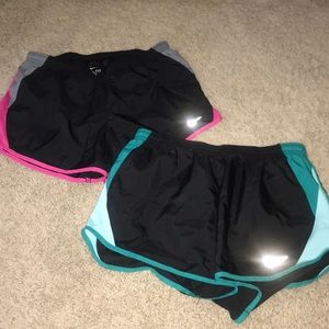 2 Pairs Pink/Turquoise Nike Running Shorts.